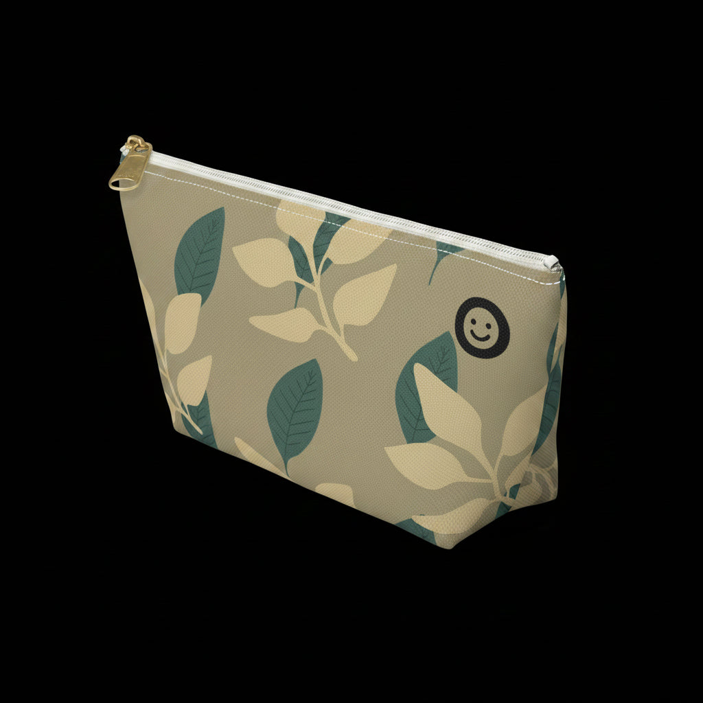 Cosmetic bag with leaf pattern and smiley face logo on a white background