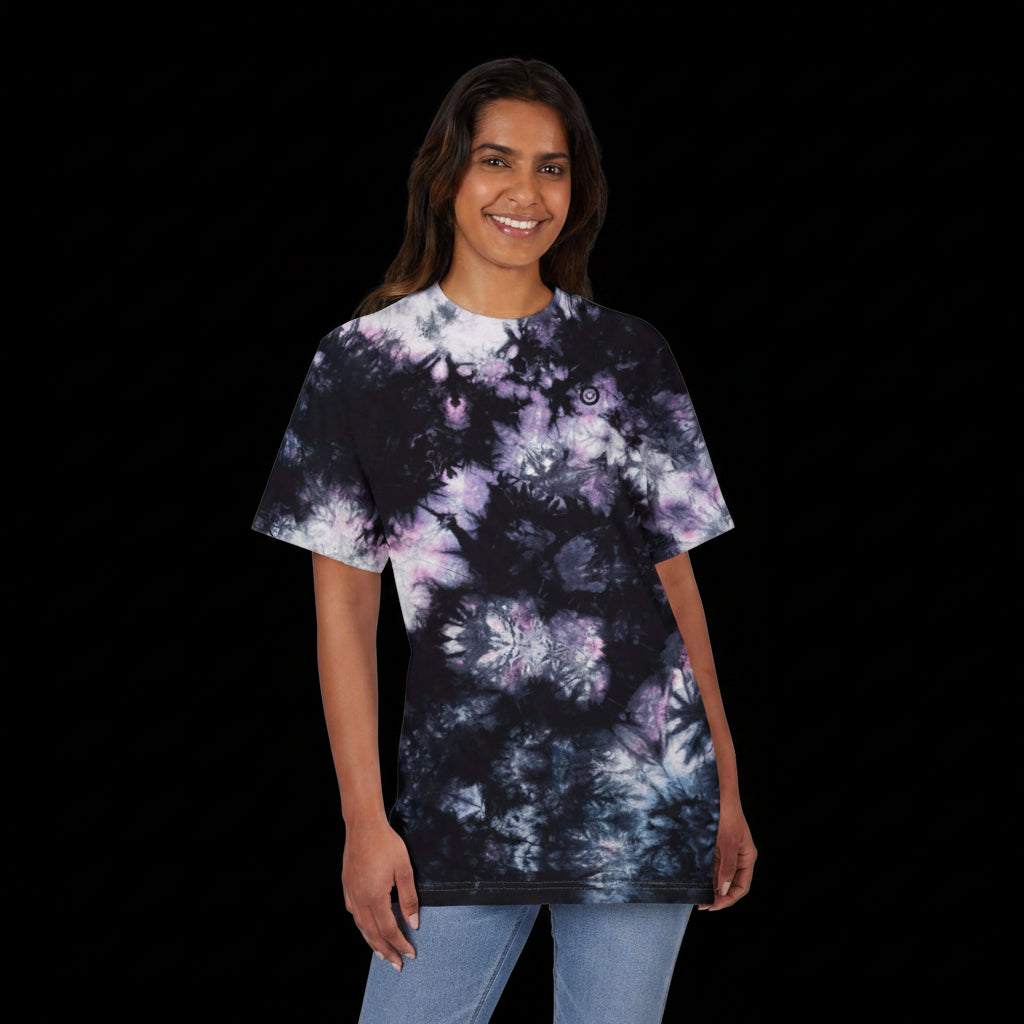 Person wearing a tie-dye t-shirt on a white background